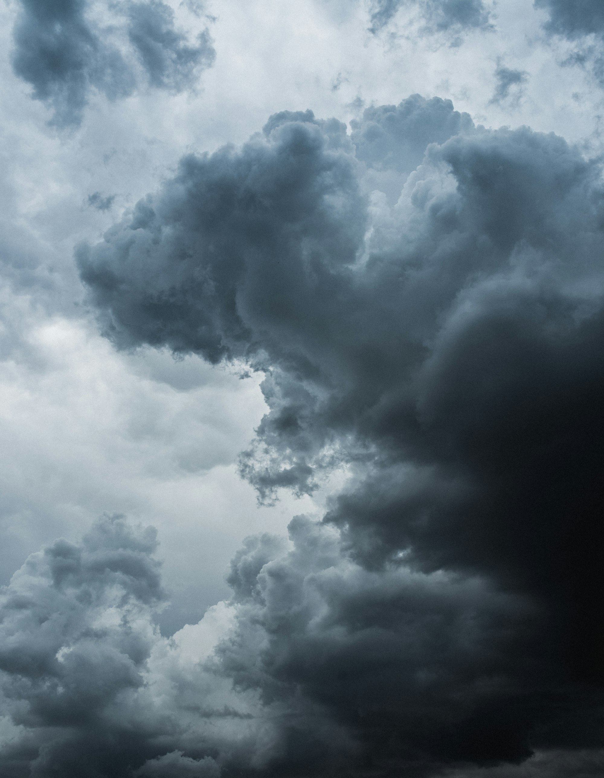 Dramatic cumulus storm clouds building in a dark sky