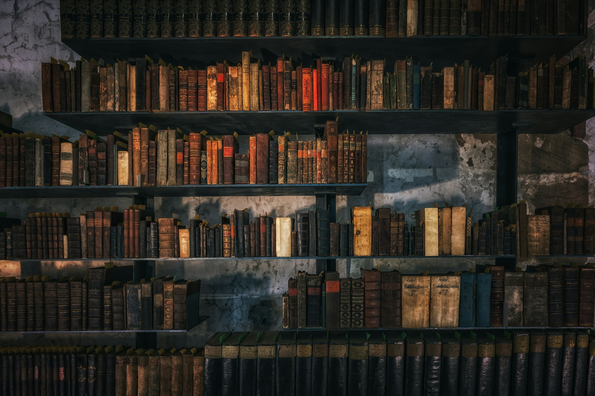 Old library shelves filled with leather-bound books in warm light